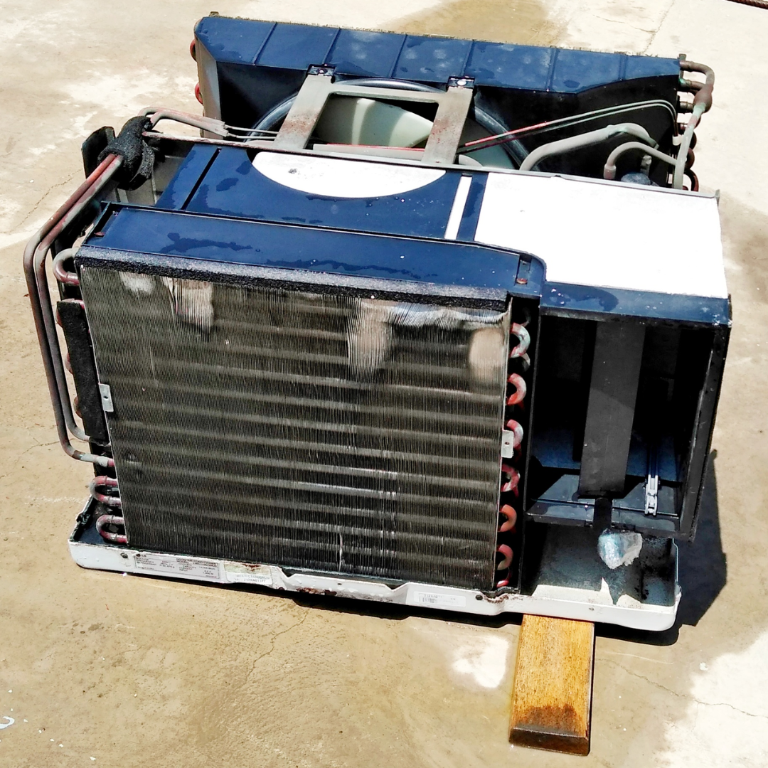 Lavado real de aire acondicionado de ventana